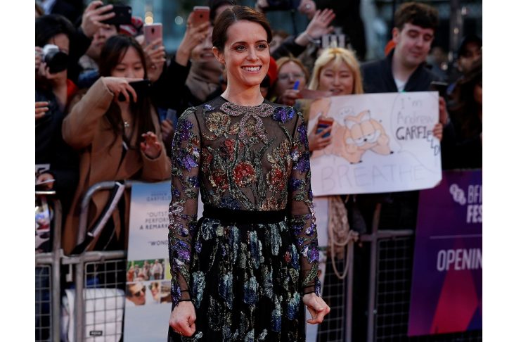 Claire Foy poses as she arrives for the opening night gala and screening of the film “Breathe” during the British Film Institute London Film Festival at Leicester Square in London