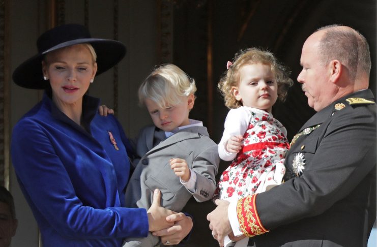 Prince Albert II of Monaco and his wife Princess Charlene hold their twins Prince Jacques and Princess Gabriella as they stand at the Palace Balcony during the celebrations marking Monaco’s National Day