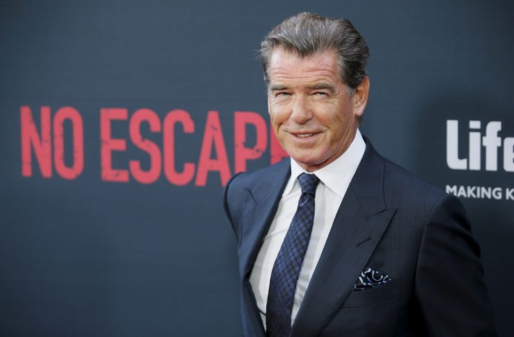 Cast member Pierce Brosnan poses at the premiere of the film “No Escape,” in Los Angeles