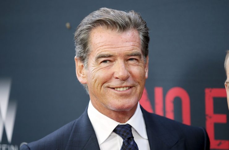 Cast member Pierce Brosnan poses at the premiere of the film “No Escape,” in Los Angeles