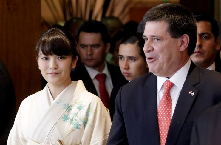 Japan’s Princess Mako and Paraguay’s President Horacio Cartes arrive to participate in the official celebration of the 80th anniversary of the Japanese immigration in Paraguay, in Luque