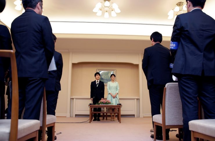 Princess Mako, the elder daughter of Prince Akishino and Princess Kiko, and her fiancee Kei Komuro, a university friend of Princess Mako, stand during a press conference to announce their engagement at Akasaka East Residence in Tokyo