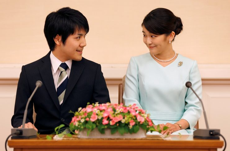 FILE PHOTO: Princess Mako, the elder daughter of Prince Akishino and Princess Kiko, and her fiancee Kei Komuro, a university friend of Princess Mako, smile during a press conference to announce their engagement at Akasaka East Residence in Tokyo
