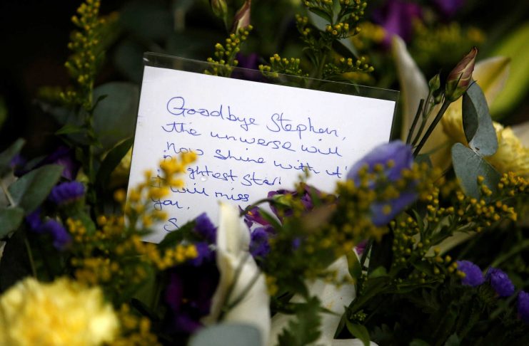 A floral tribute left outside Great St Marys Church, where the funeral of theoretical physicist Prof Stephen Hawking is being held, in Cambridge