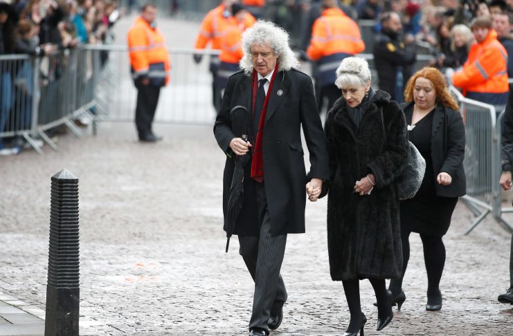 Musician Brian May and actor Anita Dobson arrive at Great St Marys Church, where the funeral of theoretical physicist Prof Stephen Hawking is being held, in Cambridge