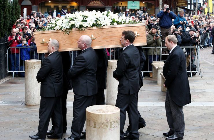 Pallbearers carry the coffin into Great St Marys Church, where the funeral of theoretical physicist Prof Stephen Hawking is being held, in Cambridge