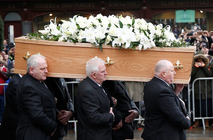 Pallbearers carry the coffin out of Great St Marys Church at the end of the funeral of theoretical physicist Prof Stephen Hawking, in Cambridge