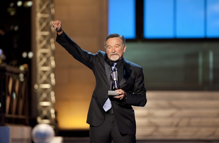 Comedian Robin Williams reacts after receiving the Stand Up Icon Award during the second annual 2012 Comedy Awards in New York