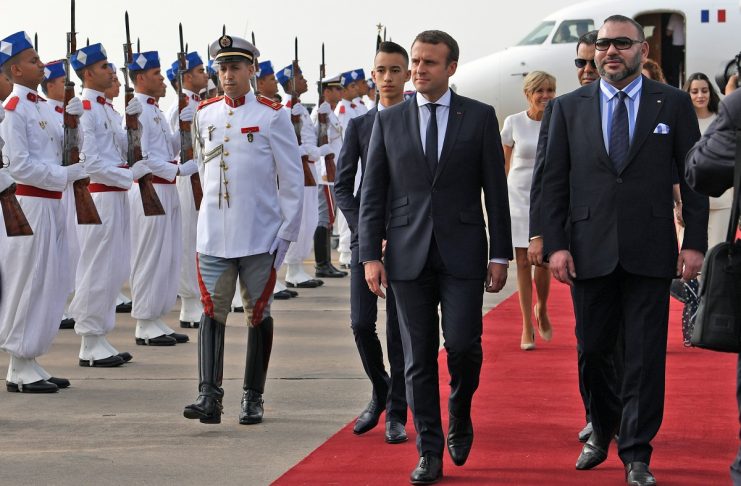 Morocco’s King Mohammed VI and French President Emmanuel Macron review the honour guard in Rabat