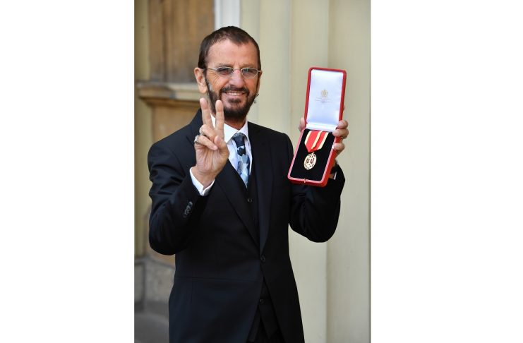 Ringo Starr, whose real name is Richard Starkey, poses after receiving his Knighthood at an Investiture ceremony at Buckingham palace in London