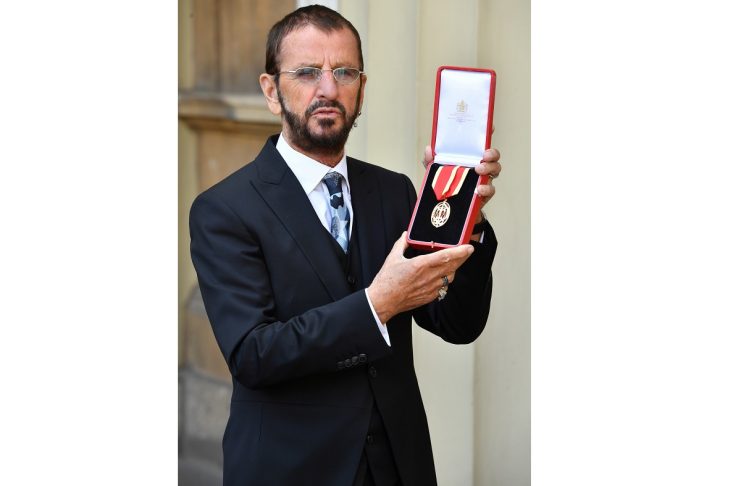 Ringo Starr, whose real name is Richard Starkey, poses after receiving his Knighthood at an Investiture ceremony at Buckingham palace in London