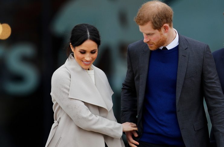 Britain’s Prince Harry, and his fiancee Meghan Markle, leave after a visit to the Titanic tourist attraction in Belfast