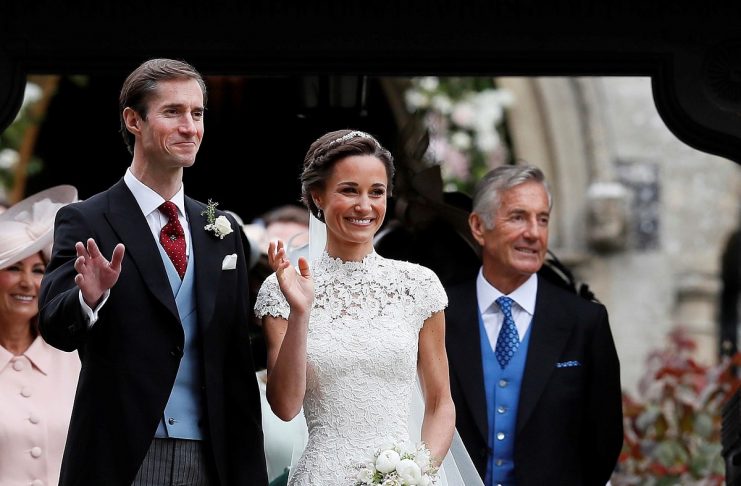 Pippa Middleton and James Matthews pose for photographs after their wedding at St Mark’s Church in Englefield