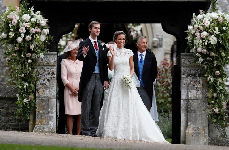 Pippa Middleton and James Matthews pose for photographs after their wedding at St Mark’s Church in Englefield