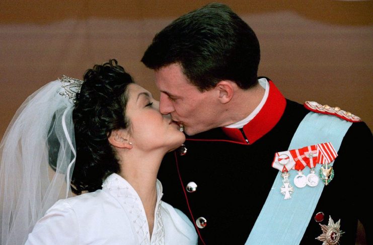 Denmark’s Prince Joachim kisses his bride Alexandra after the wedding ceremony at the 17th century c..