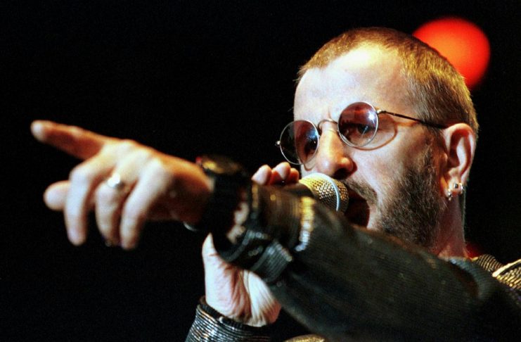 Former Beatles drummer Ringo Starr points towards the audience during his performance at the Open Ai..