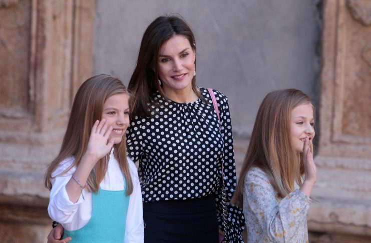 Spanish Royal Family Queen Letizia and daughters Infantas Leonor and Sofia gesture after attending an Easter Sunday mass at Palma de Mallorca’s Cathedral on the Spanish island of Mallorca
