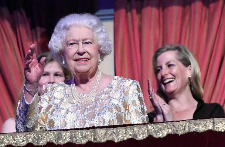 Britain’s Queen Elizabeth waves during a special concert “The Queen’s Birthday Party” to celebrate her 92nd birthday at the Royal Albert Hall in London