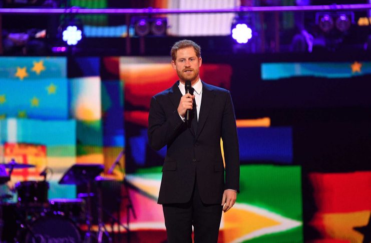 Britain’s Prince Harry speaks during a special concert “The Queen’s Birthday Party” in London
