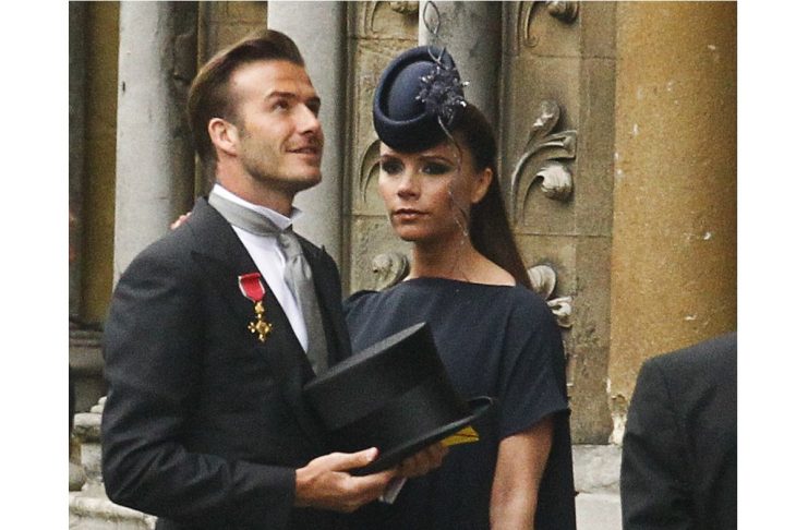 Soccer star David Beckham and his wife Victoria arrive at Westminster Abbey before the wedding of Britain’s Prince William and Kate Middleton, in central London