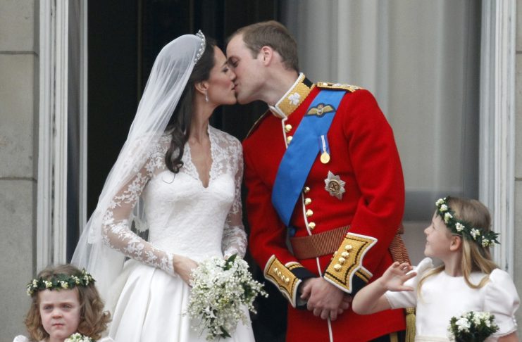 Britain?s Prince William and his wife Catherine, Duchess of Cambridge, kiss as they stand on the balcony at Buckingham Palace after their wedding in Westminster Abbey, in central London