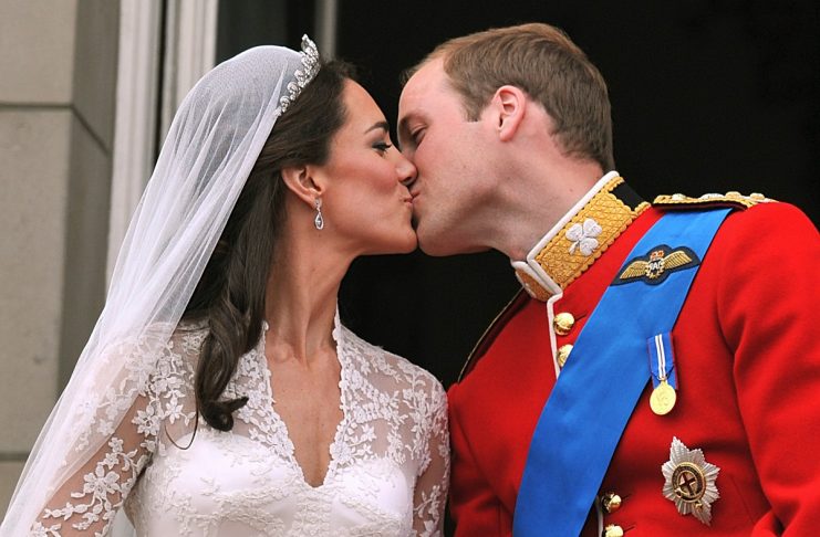Britain’s Prince William and his wife Catherine, Duchess of Cambridge kiss on the balcony of Buckingham Palace