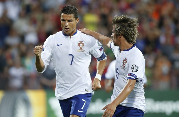 Portugal’s Ronaldo celebrates with Coentrao after scoring penalty against Armenia during their Euro 2016 qualifier in Yerevan