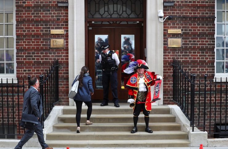 A man dressed as a town crier stands outside the Lindo Wing of St Mary’s Hospital after Britain’s Catherine, the Duchess of Cambridge, gave birth to a son, in London