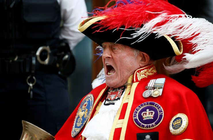 A man dressed as a town crier shouts outside the Lindo Wing of St Mary’s Hospital after Britain’s Catherine, the Duchess of Cambridge, gave birth to a son, in London