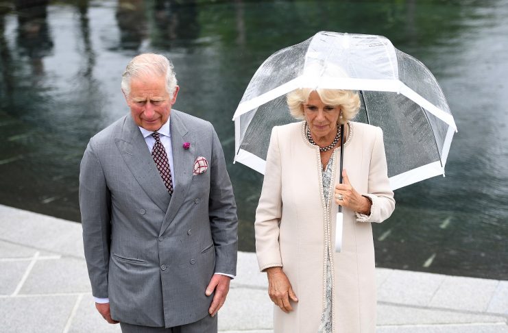 Britain’s Prince Charles and Camilla, the Duchess of Cornwall, stand in the memorial garden for the victims of the Omagh bombing, in Omagh, Northern Ireland