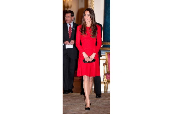 A combination photo shows Britain’s Catherine, Duchess of Cambridge, arriving for Queen Elizabeth’s Diamond Jubilee River Pageant on June 3, 2012 and attending a reception for the dramatic arts in London (R) February 17, 2014