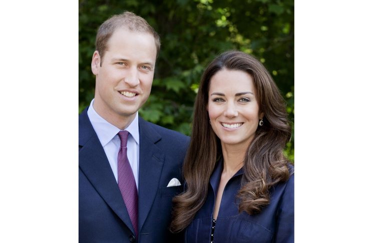Britain’s Prince William and Catherine, Duchess of Cambridge pose for the official tour portrait for their trip to Canada and California, in the gardens of Clarence House in London