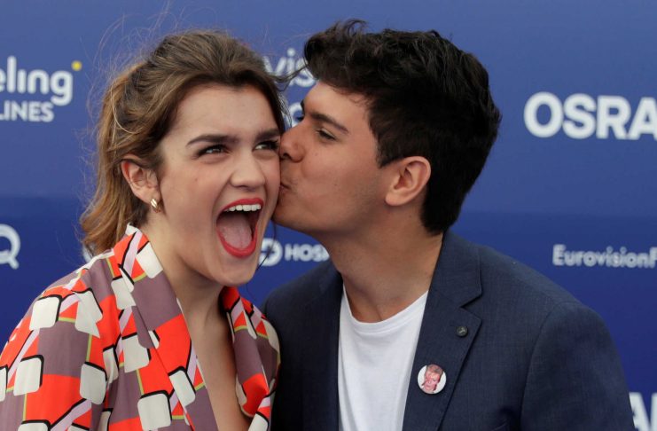 Contestants Amaia and Alfred of Spain kiss on the blue carpet during the opening party for Eurovision Song Contest at the Maat museum in Lisbon