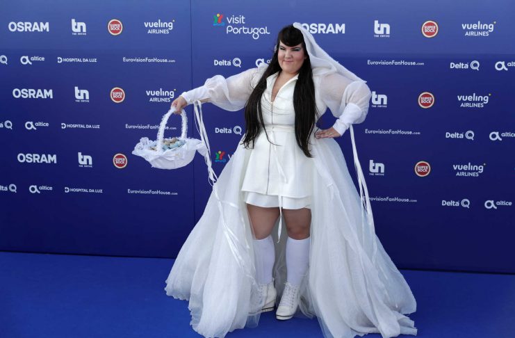 Contestant Netta of Israel poses on the blue carpet during the opening party for Eurovision Song Contest at the Maat museum in Lisbon