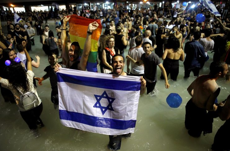 People celebrate the winning of the Eurovision Song Contest 2018 by Israel’s Netta Barzilai with her song “Toy” , at Rabin square in Tel Aviv
