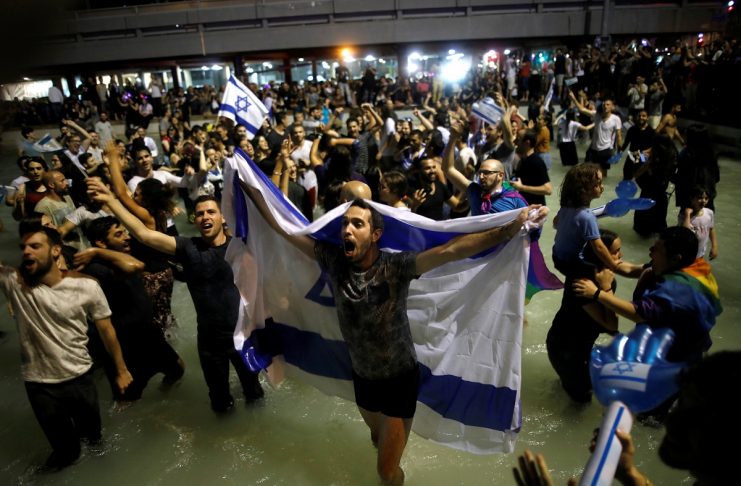 People celebrate the winning of the Eurovision Song Contest 2018 by Israel’s Netta Barzilai with her song “Toy” , at Rabin square in Tel Aviv, Israel