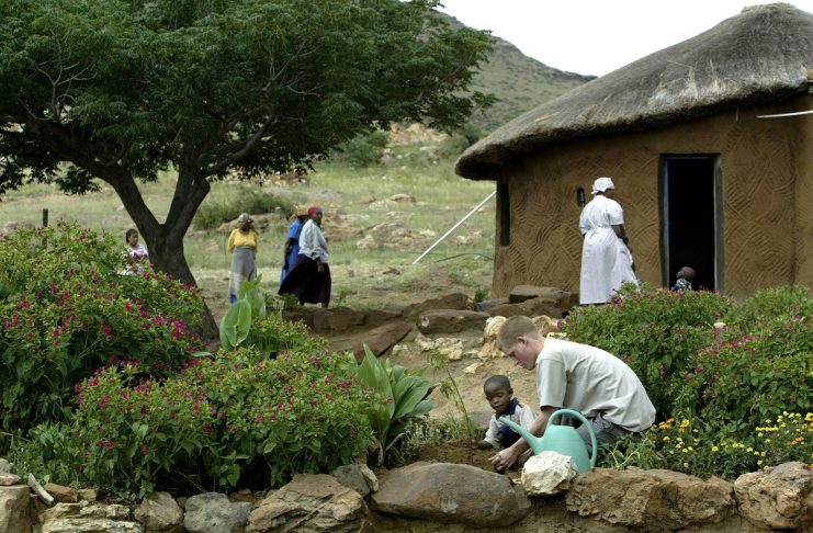 PRINCE HARRY PLANTS A TREE AT THE MANTS’ASE CHILDRENS HOME NEAR MAHLES HOEK IN LESOTHO.