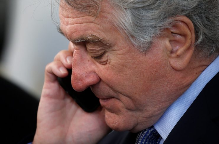 Actor Robert De Niro talks on his phone as he arrives to receive his Chaplin Award from the Film Society of Lincoln Center in the Manhattan borough of New York