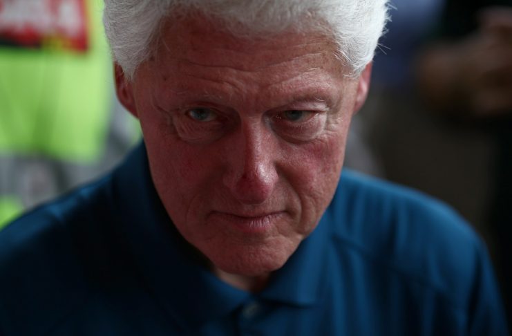 Former U.S. president Clinton visits a market after Hurricane Maria hit the island in September, in San Juan