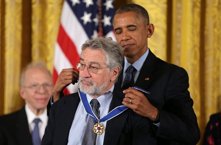 President Obama puts medal on actor Robert DeNiro at Presidential Medal of Freedom ceremony at White House in Washington