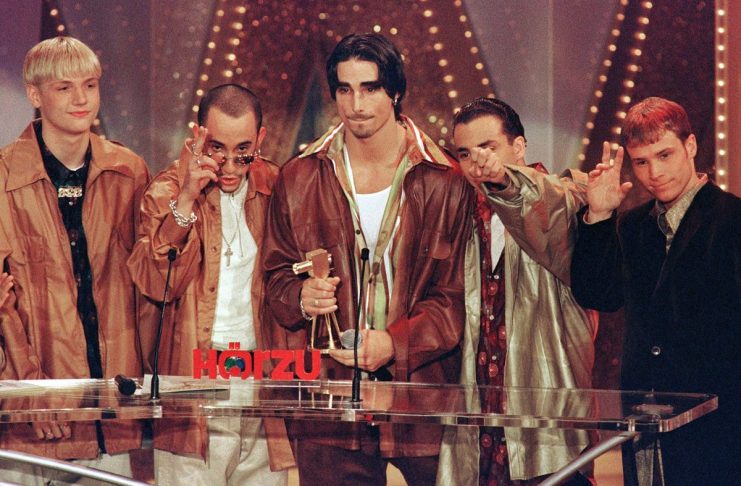 Members of the US pop group Backstreet Boys gesture after they received the Golden Camera award at B..
