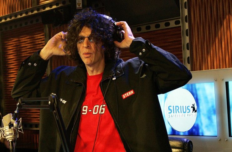 Stern adjusts his headphones before start of news conference on his first day of Sirius Satellite Radio in New York