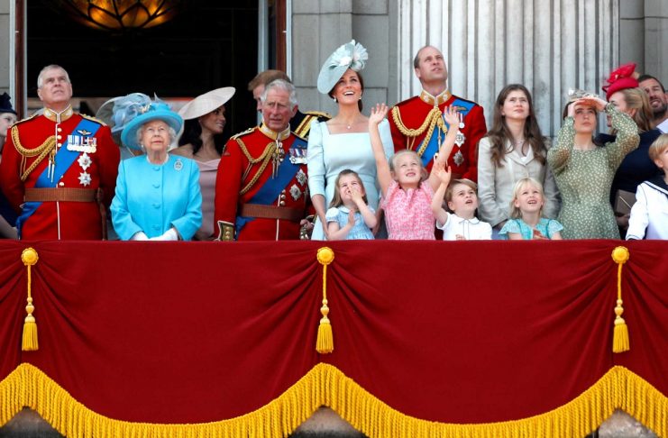 Britain’s Queen Elizabeth, along with other members of the British royal family, look up at the RAF flypast from the balcony of Buckingham Palace as part of Trooping the Colour parade in central London