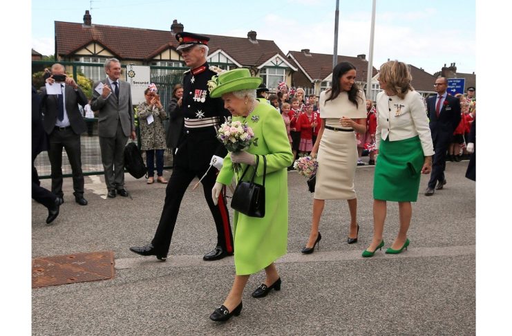 Britain’s Queen Elizabeth and Meghan, the Duchess of Sussex, arrive in Runcorn