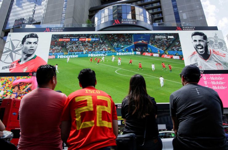 People watch the World Cup Group B – Portugal vs Spain soccer match at Times Square in New York City, New York