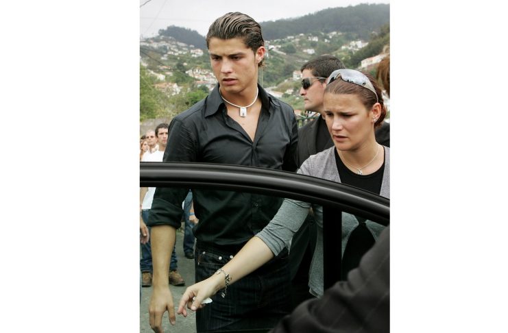 Manchester United player Cristiano Ronaldo is seen with his sister after the funeral of their …