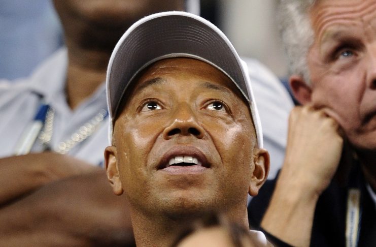 Co-founder of Def Jam Recordings Russell Simmons watches from the crowd as Serena Williams of the U.S. plays Flavia Pennetta of Italy during their match at the U.S. Open tennis championship in New York