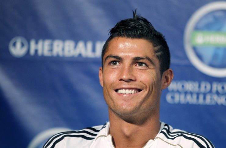 Real Madrid’s Ronaldo smiles at a question from the media at a news conference in Los Angeles