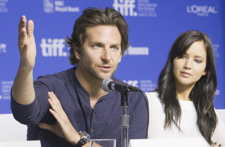 Actors Cooper and Lawrence attend a news conference to promote their film “Silver Linings Playbook” during the 37th Toronto International Film Festival