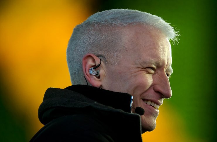 TV host Anderson Cooper smiles while working in Times Square on New Year’s Eve in New York